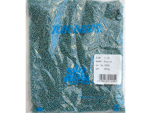 PV toho 11/0 isc rainbow light sapphire-opaque teal lined 250 gram